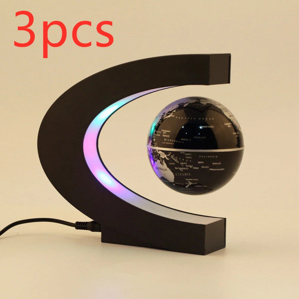 Magnetic levitation globe floating above base with LED light on