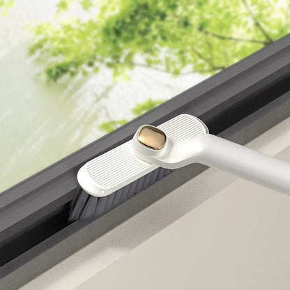 Multi-function rotating crevice cleaning brush in purple, white, and brown for kitchen and bathroom cleaning