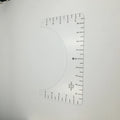 Transparent acrylic sewing ruler patch for T-shirt alignment, 10x6 inches.