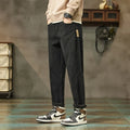 Men's corduroy casual trousers in tapered straight-leg style with mid waist and zip fly