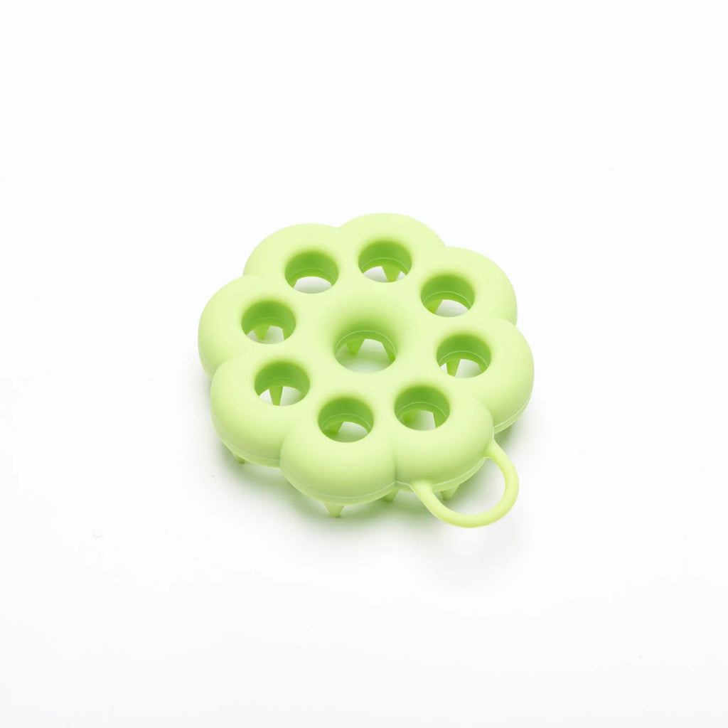 Silicone pet grooming brush with ergonomic handle shown in multiple colours: blue, green, orange, pink, purple.
