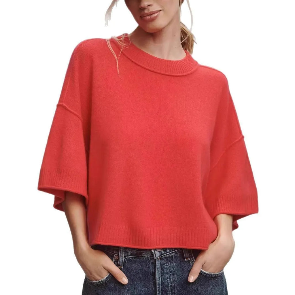 Red viscose short T-shirt with an exposed navel design on a mannequin, front view.
