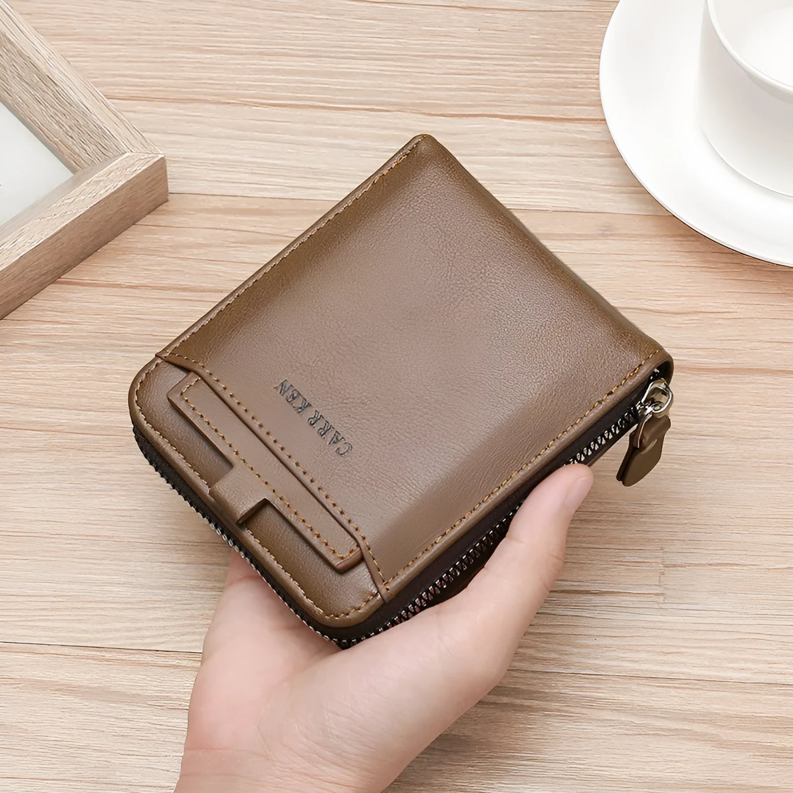Men's short casual zipper wallet in black polyurethane leather with horizontal square shape and sewing thread detailing.