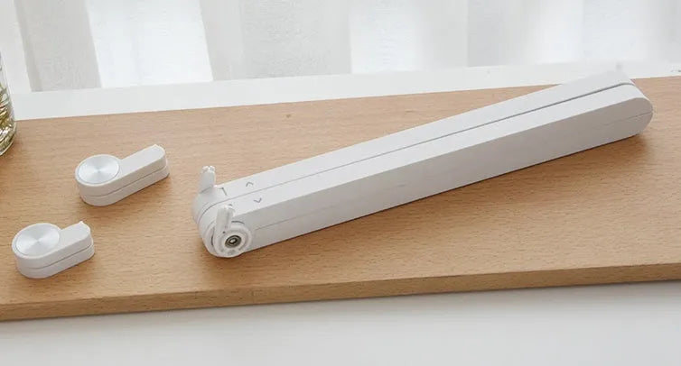 White portable laptop cooling stand with adjustable height and folding mechanism
