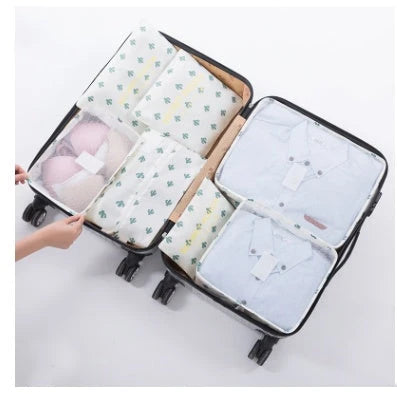 Durable waterproof packing cubes in various colors for organized, efficient travel