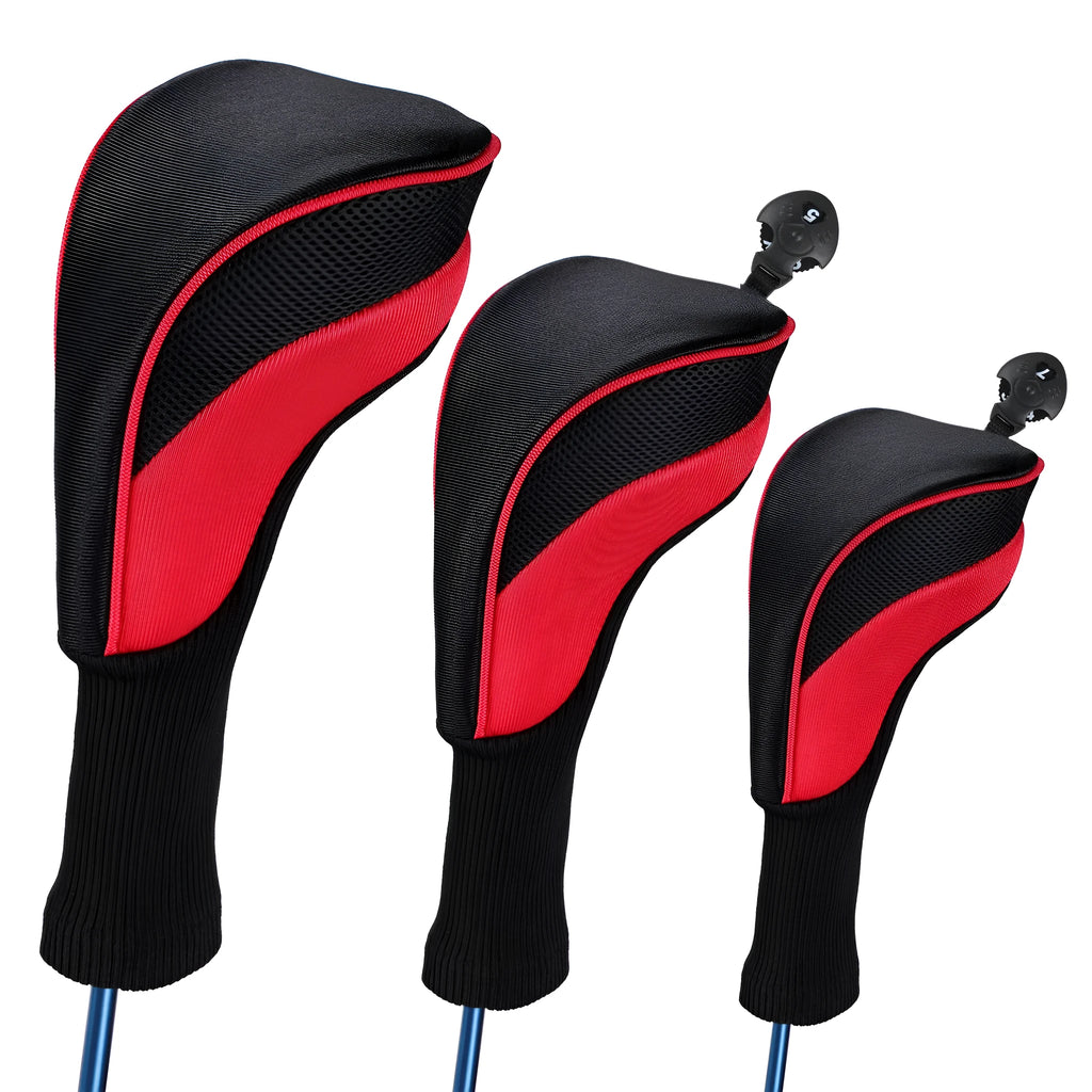 Set of six fabric golf club covers in blue, black, red, and multi-colour designs laid out on grass