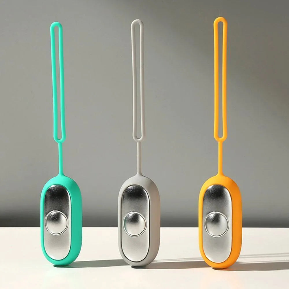 Handheld micro-current sleep aid device with round button and USB charging port