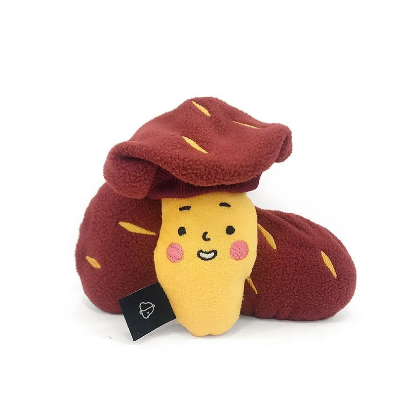 Red sweet potato-shaped dog toy with a peelable layer and hidden treat pocket for interactive play.