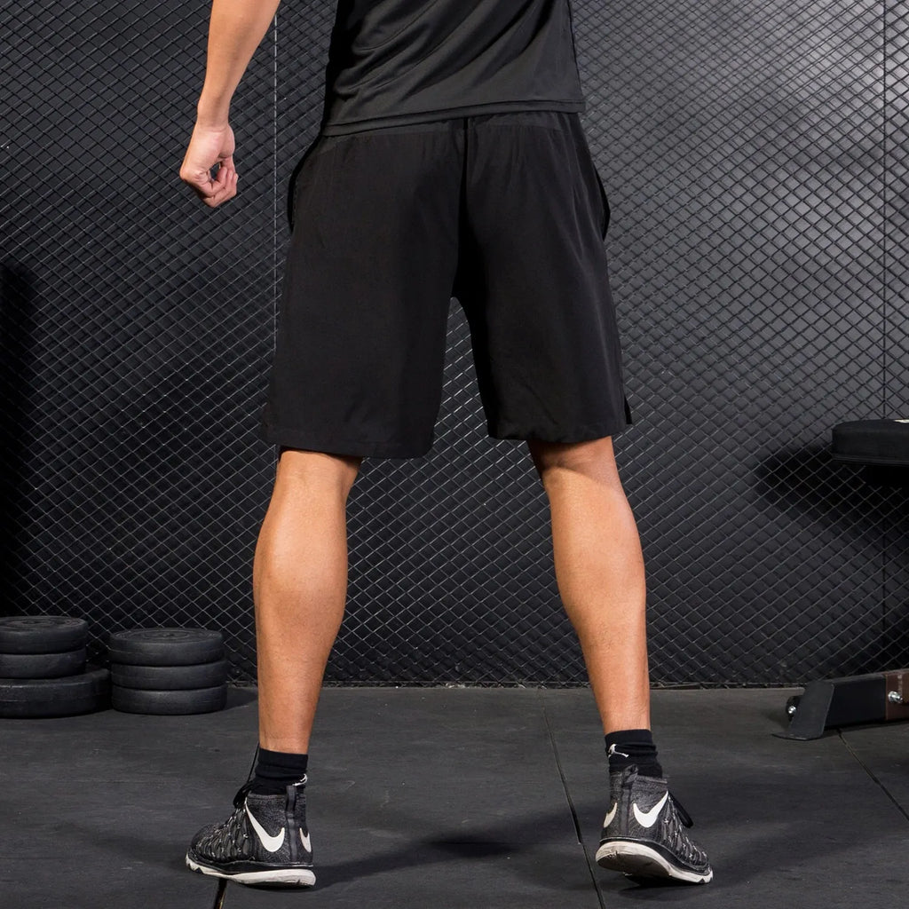 Men's reflective basketball shorts in camouflage and stripes pattern, black colour, polyester fibre
