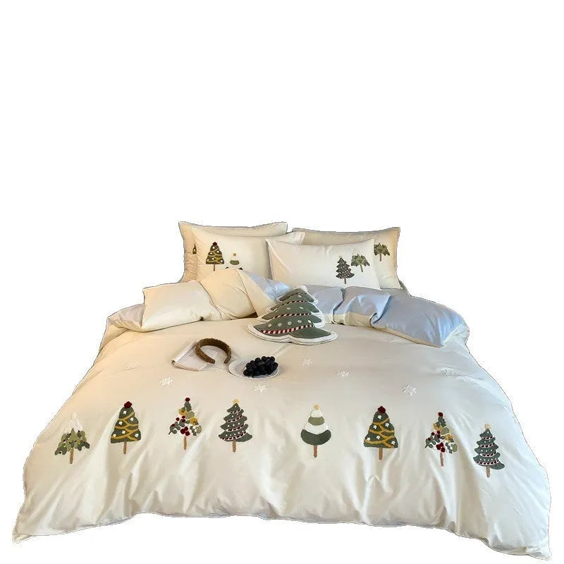 Cream blue cotton duvet cover and pillowcases with embroidered green Christmas tree and flower design.