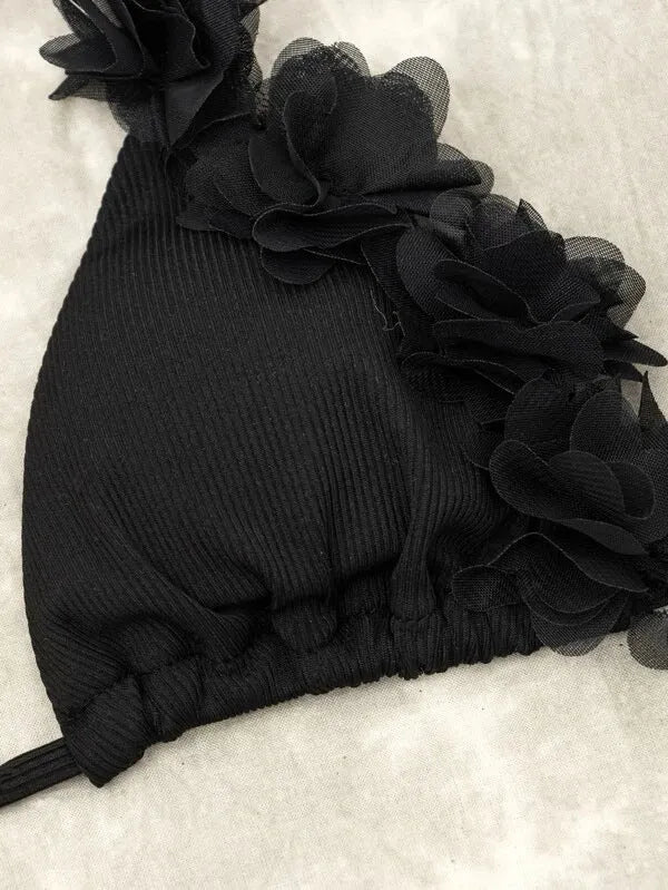 Black women's swimwear set with gathered top and matching shorts on European and American sizing