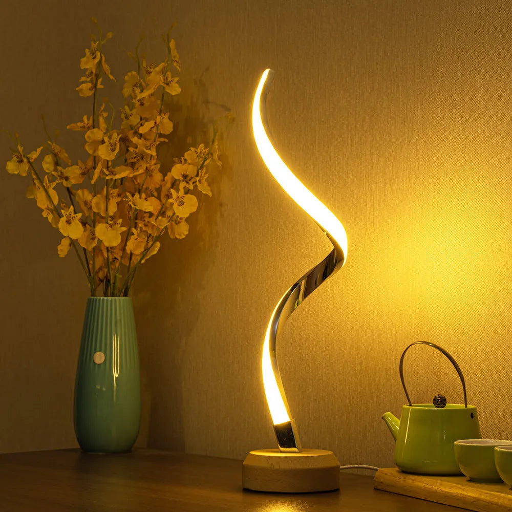 Modern wood LED spiral table lamp with touch dimmer and USB power on a bedside table