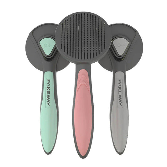 Ergonomic pet grooming brush in mint green, cherry blossom powder, and gentleman grey