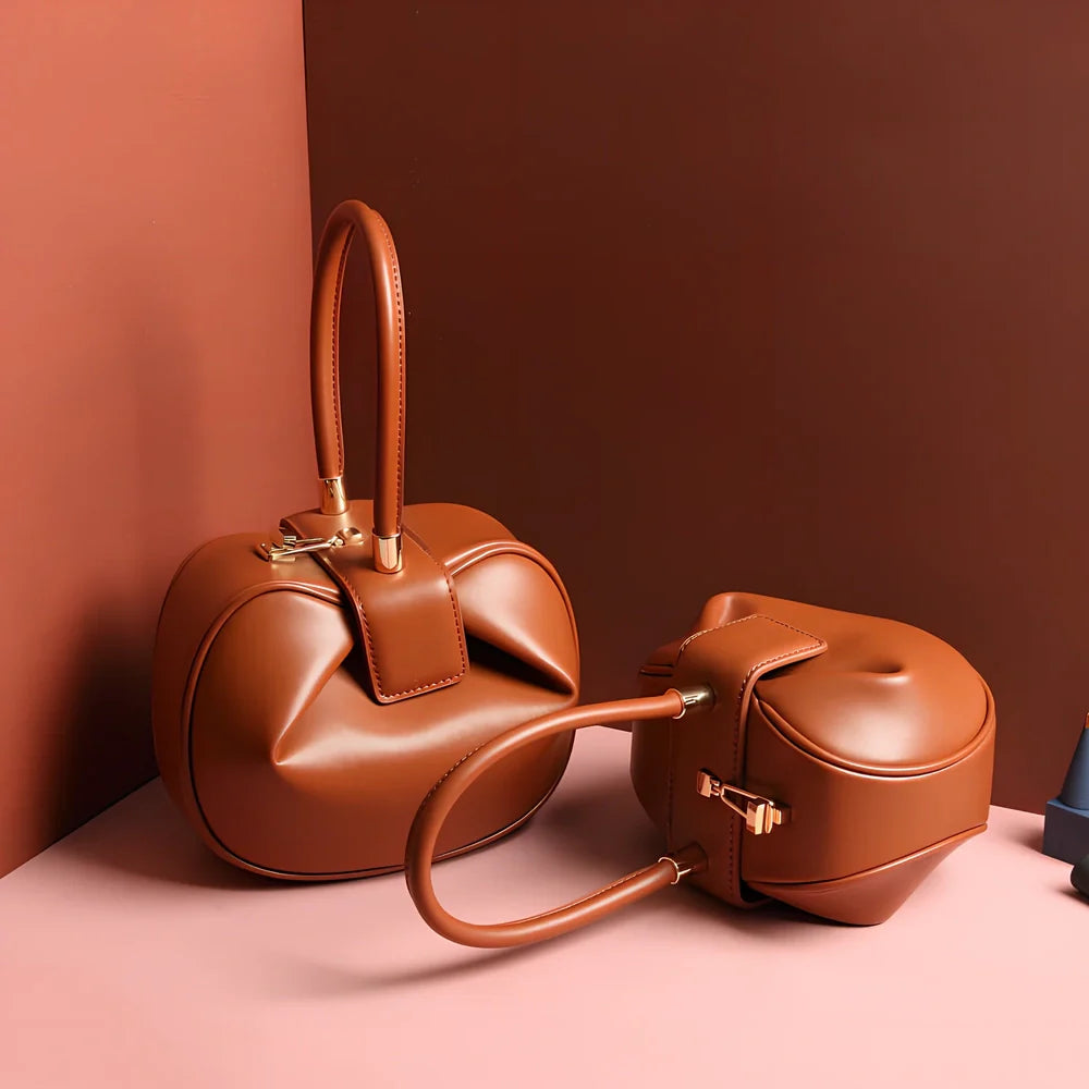 Women's cowhide leather tote bag in tramp shape with single handle and buckle, available in apricot, black, and other colours, big size 35cm x 40cm