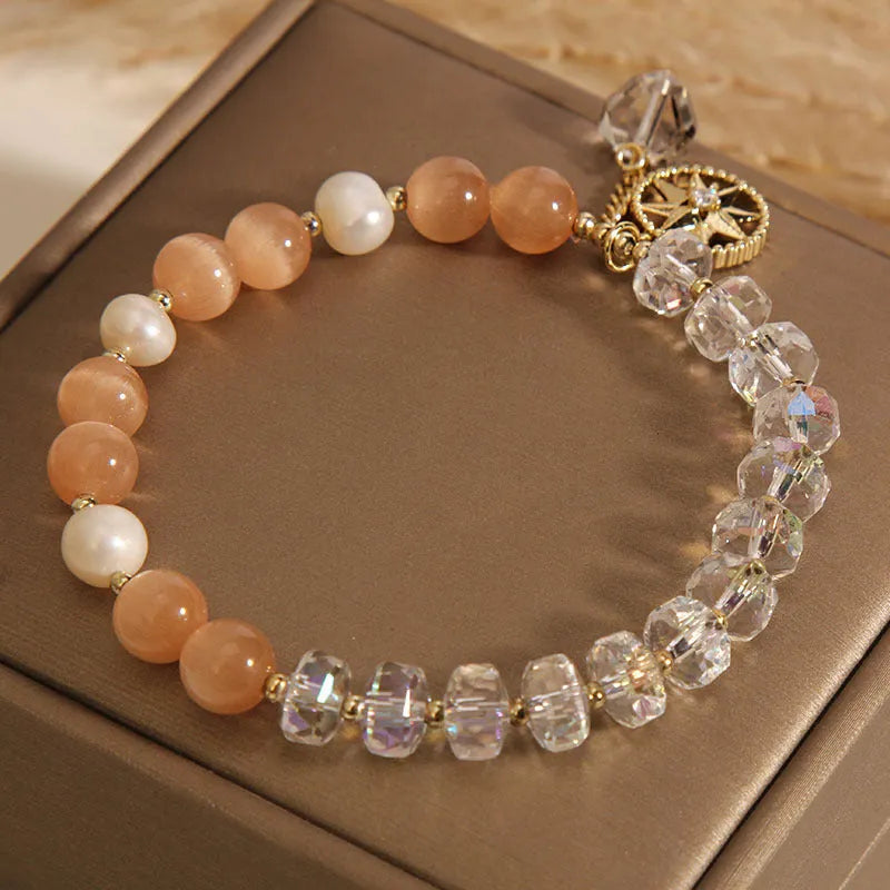 Orange eight Awn star bracelet with gold-plated inlaid gemstones showing detailed design