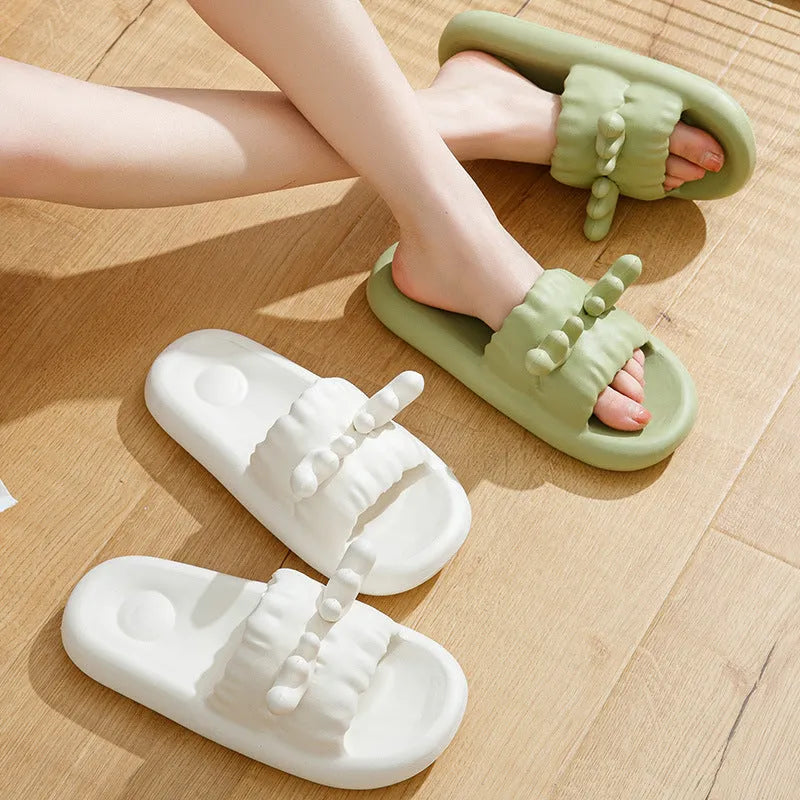 Women's flip-flop style slippers with deer horn design, shown in light yellow on a non-slip EVA sole.