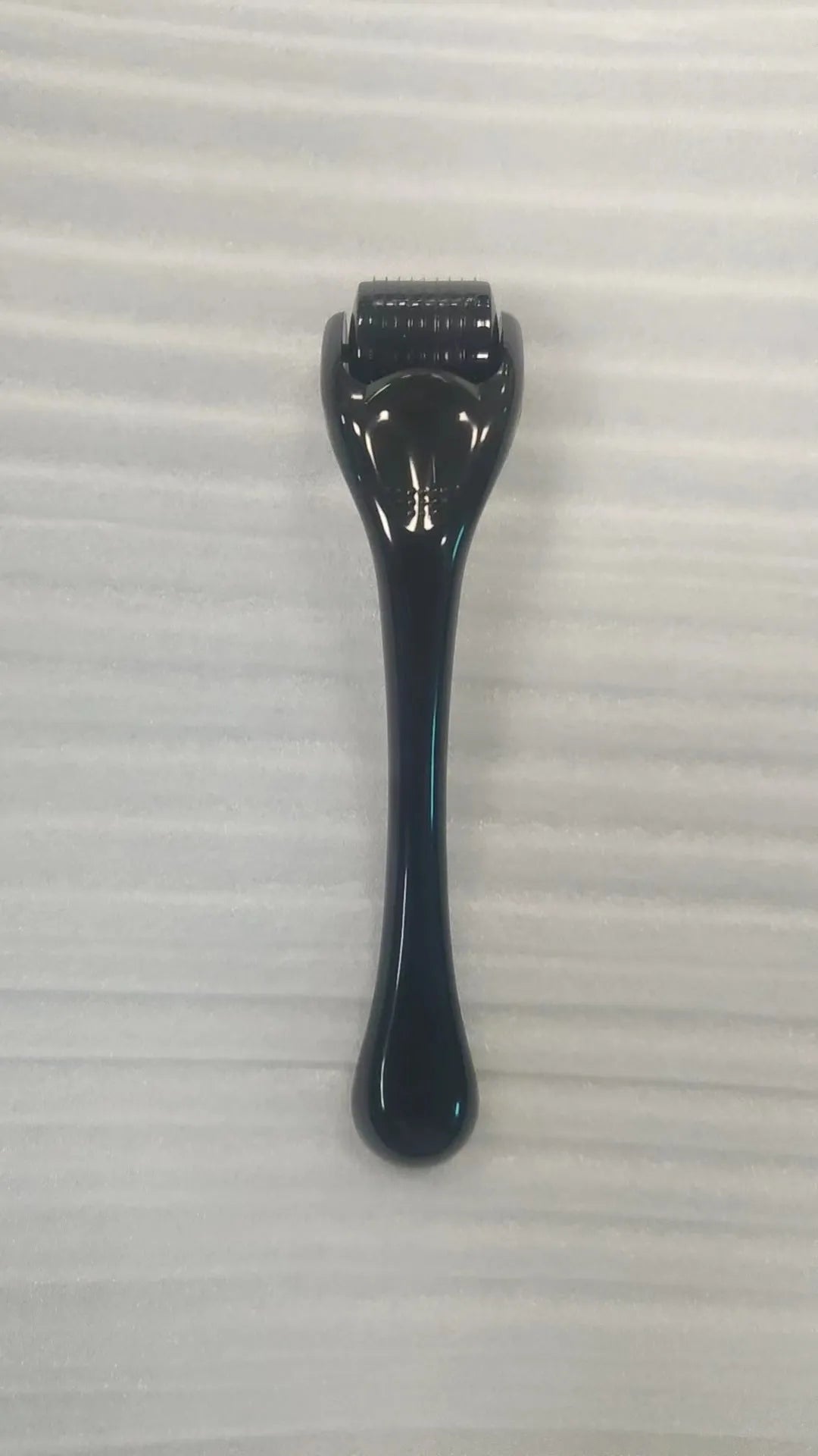 540 needle microneedle derma roller with colour wheel on black handle, showing 0.25mm specification.