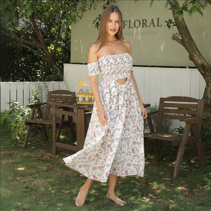 Women's off-shoulder strapless floral dress in a vibrant pattern, perfect for summer outings.