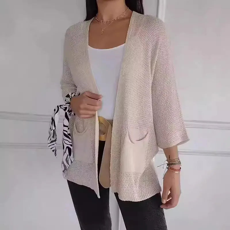 Women's waffle texture cardigan coat in army green with nine-quarter length sleeves and pockets.