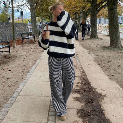 Women's striped print trousers with lace-up detail and wide-leg design in various colours