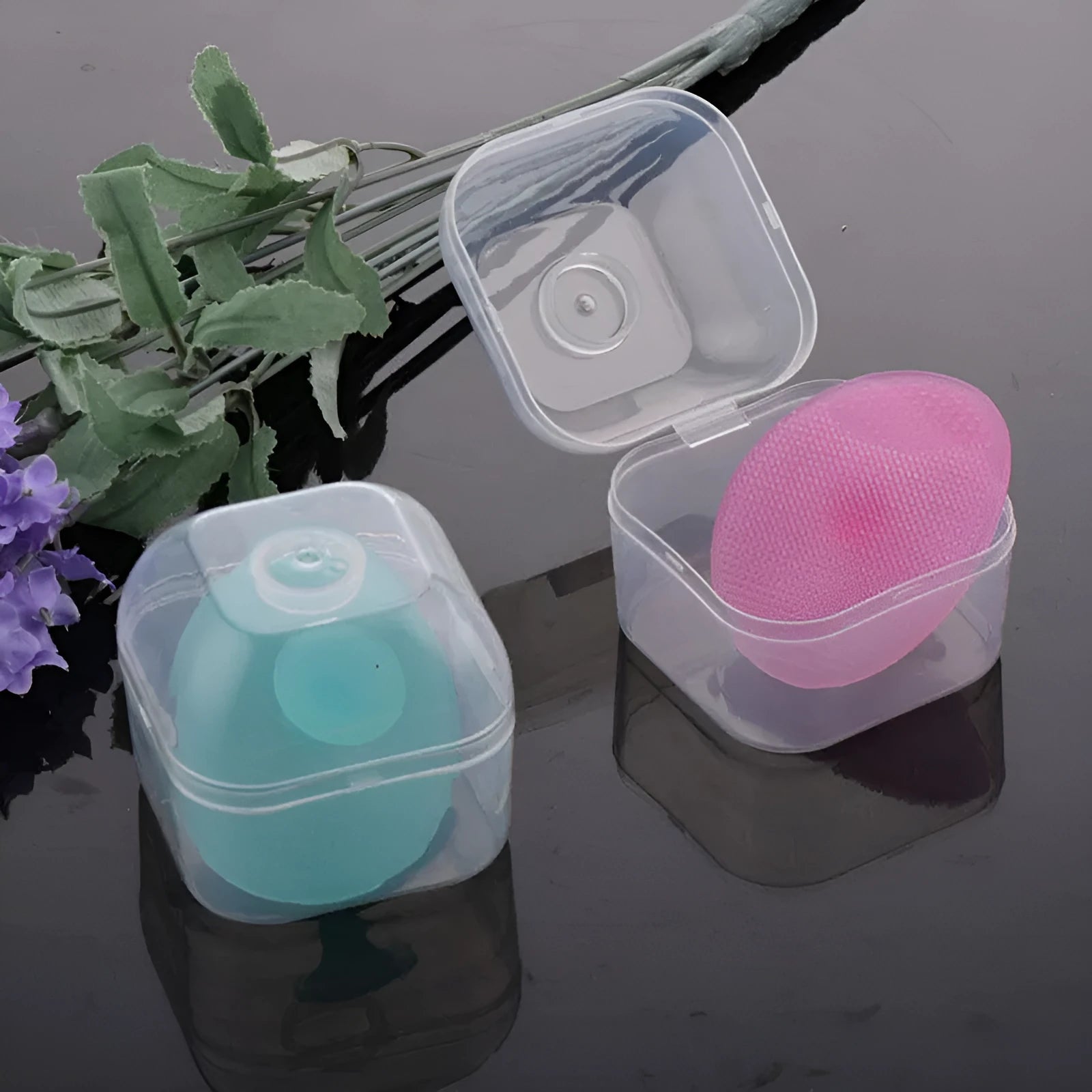 Silicone facial brush in three bristle zones with suction cup on blue background