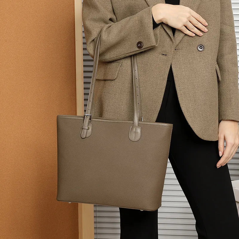Genuine leather women's tote bag in retro square style with internal organiser pockets.