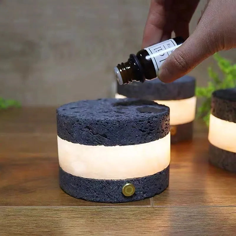 Small orange volcanic rock USB night lamp with warm light, shown next to a USB cable