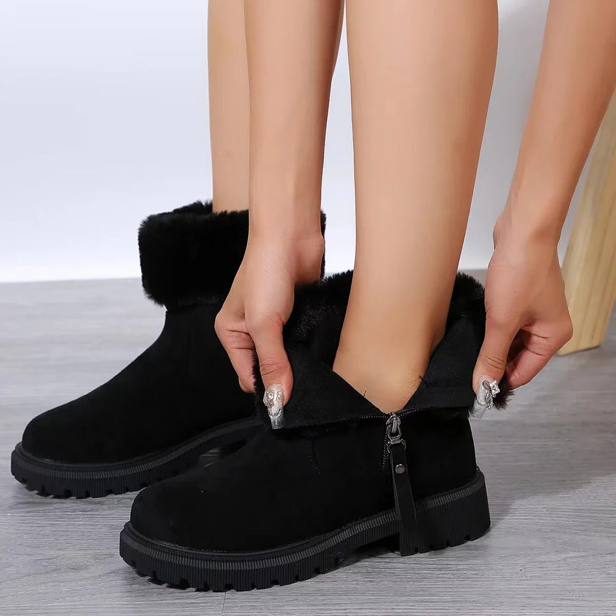 Stylish plush winter boots for women with side zipper, available in beige and black colors, featuring a suede upper and plush lining for maximum warmth and comfort.