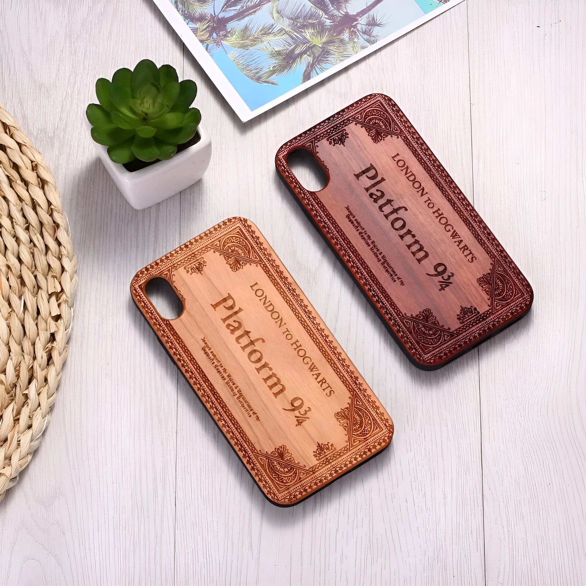 Wooden iPhone case with laser-carved floral design and black TPU bumper on a rosewood back.