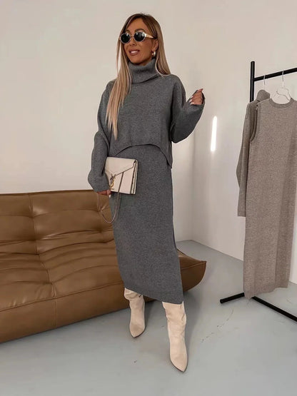 Women's winter fashion two-piece set featuring a turtleneck pullover and sleeveless long dress in white, grey, or camel.
