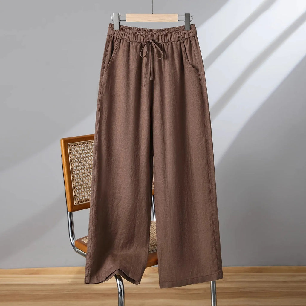 Women's straight-leg casual trousers with elastic drawstring waist in apricot colour.