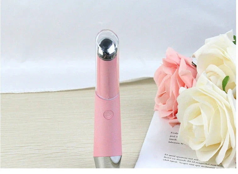 Portable eye massager with vibration and heat therapy to reduce wrinkles, dark circles, and puffiness around the eyes