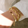 Set of 6 women's stretch bracelets with natural glass stones and gold beads arranged on a white surface