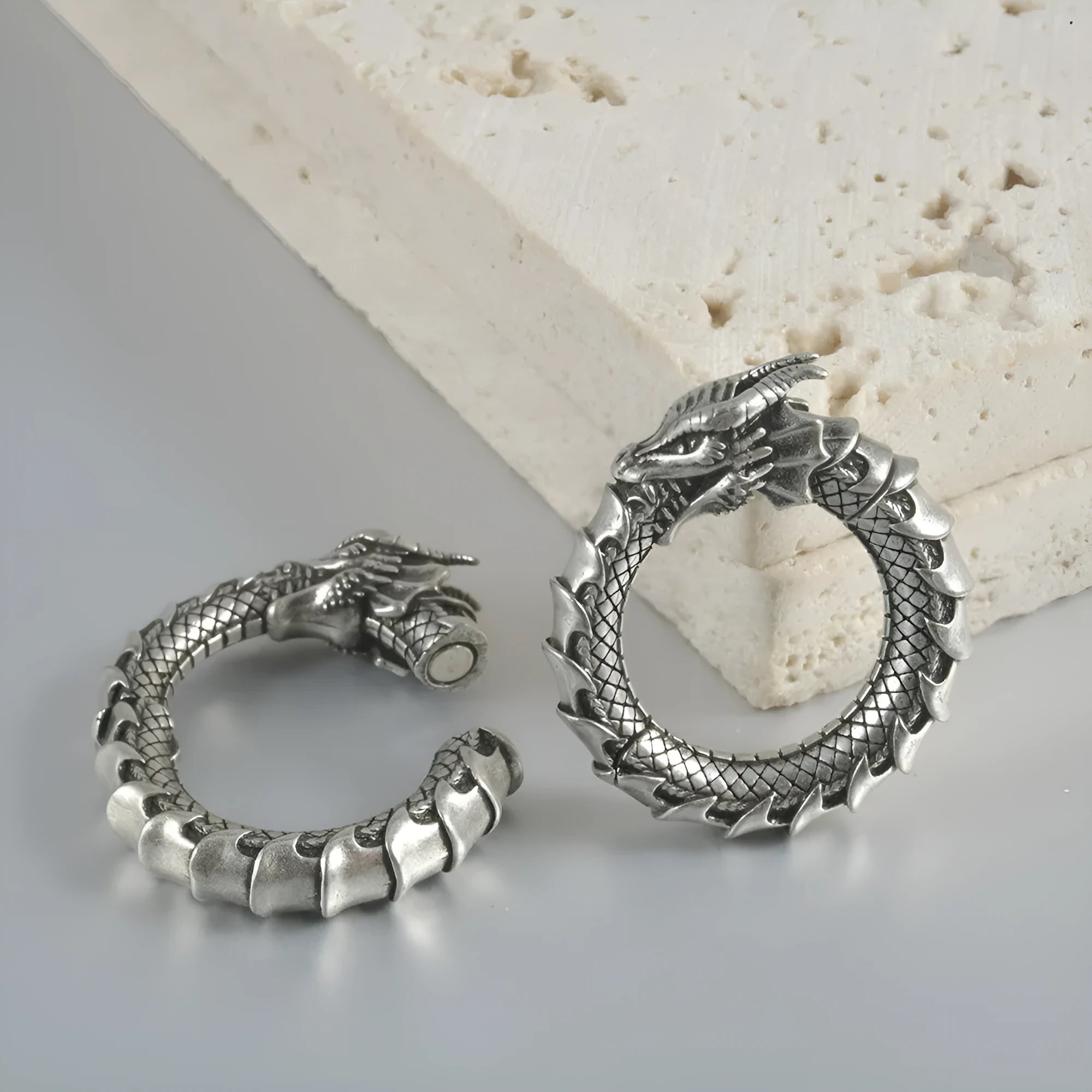 Large retro alloy earrings with hollow-out copper auricle shape and antique silver dragon design.