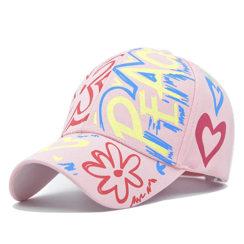 Cotton twill alphabet baseball cap in red, black, white, and pink options with adjustable strap