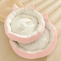 Round suede cat mat in pink grey with cat ear shape, 36cm diameter, on a light floor