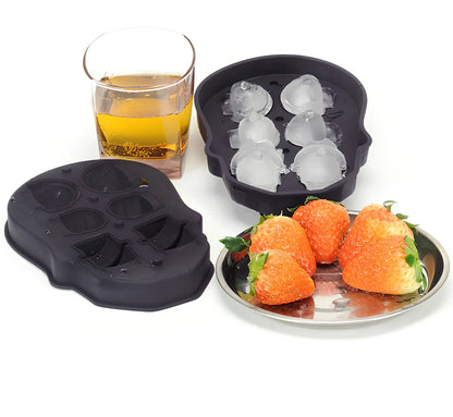 Black silicone ice cube tray with four skull-shaped cavities measuring 12cm long