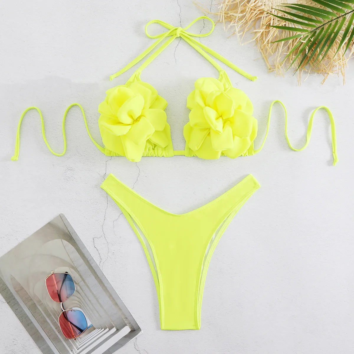 Low waist bikini swimsuit with 3D flower design in solid colour