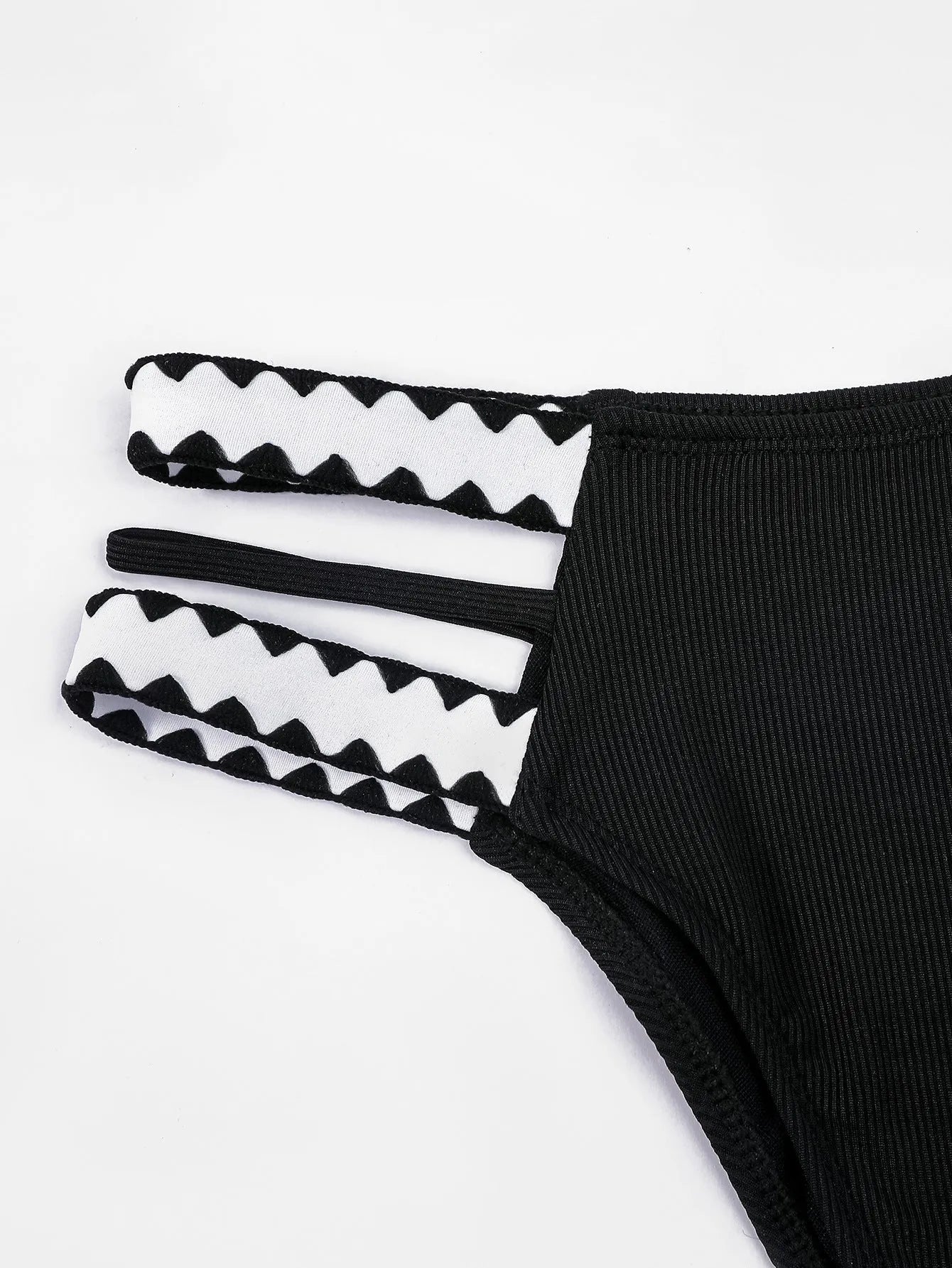 Black women's hollowed-out split swimsuit bikini set with cut-out design detail