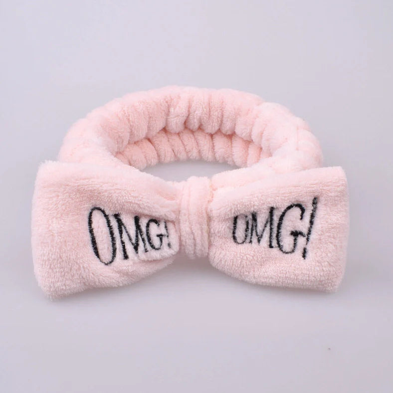 Coral velvet butterfly end hair band in pink with text styling, showing butterfly ends and cloth material