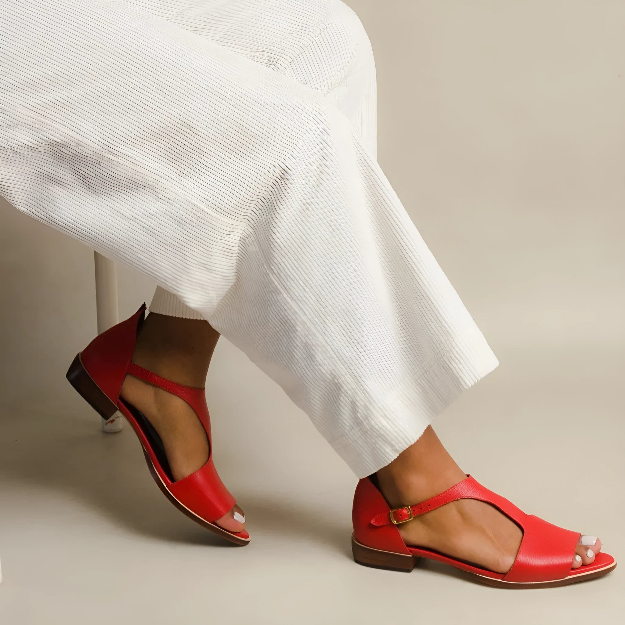 Red women's plus size casual sandals with a square buckle and herringbone toe strap.
