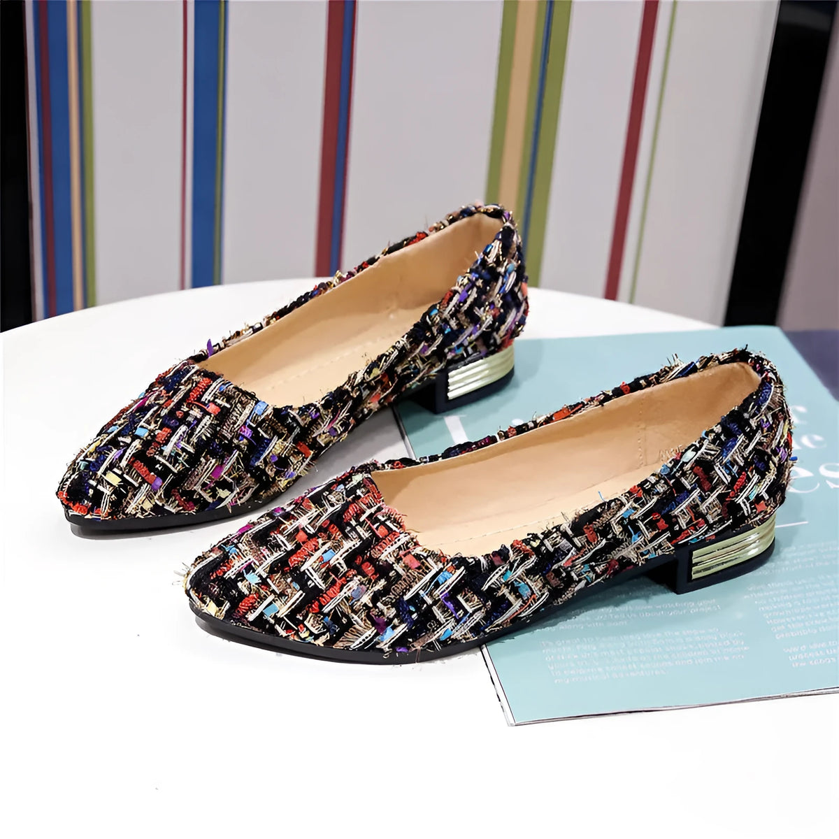 Women's black and white canvas casual shoes with pointed toe and flat rubber sole