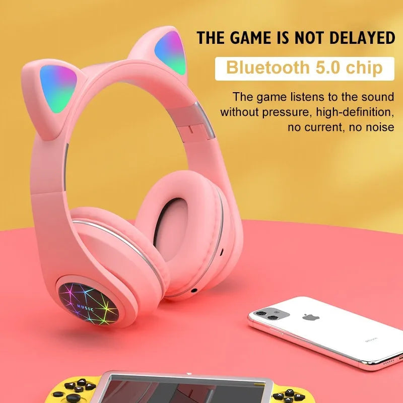 Cat ear design wireless Bluetooth headphones shown in multiple colours including pink, black, and blue.