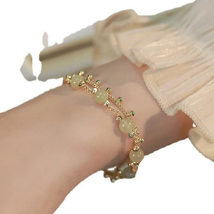 Escape Princess Natural Hetian Jade Bracelet showing beaded design with Princess Running elements