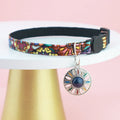 Adjustable polyester cat collar with locator protective cover in navy blue on a white background