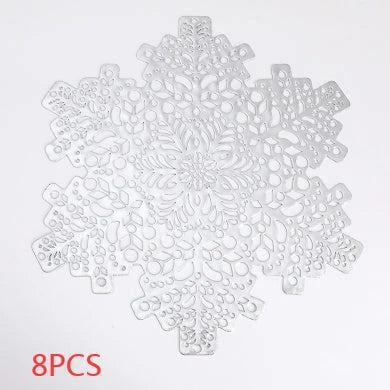 Stylish snowflake-patterned placemats in gold and silver, designed for heat resistance and spill protection on dining tables