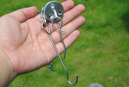 Silver aluminium camping tripod with hanging chain for outdoor barbecue cooking