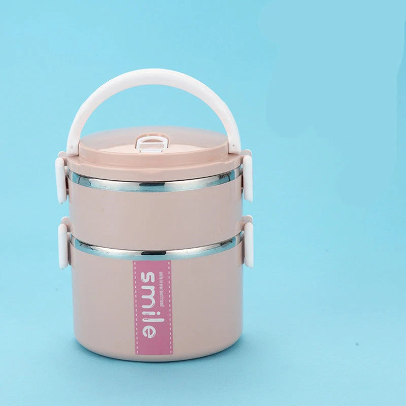 Stainless steel lunch box with built-in spoon, leak-proof design, in green, pink, and blue