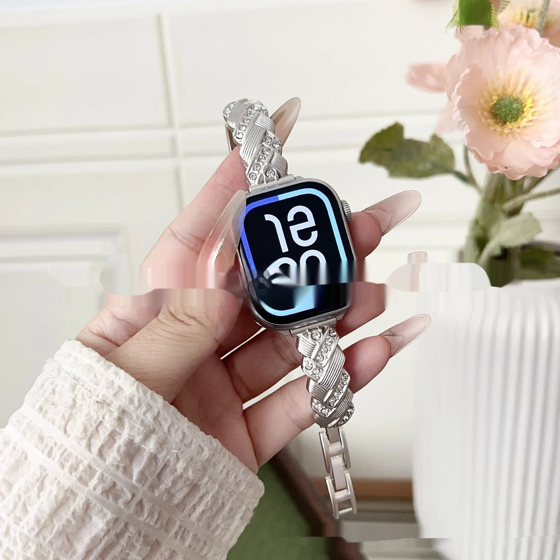 Zinc alloy metal Apple Watch band with twist and diamond design in silver, rose gold, gold, black, and Starlight colours.