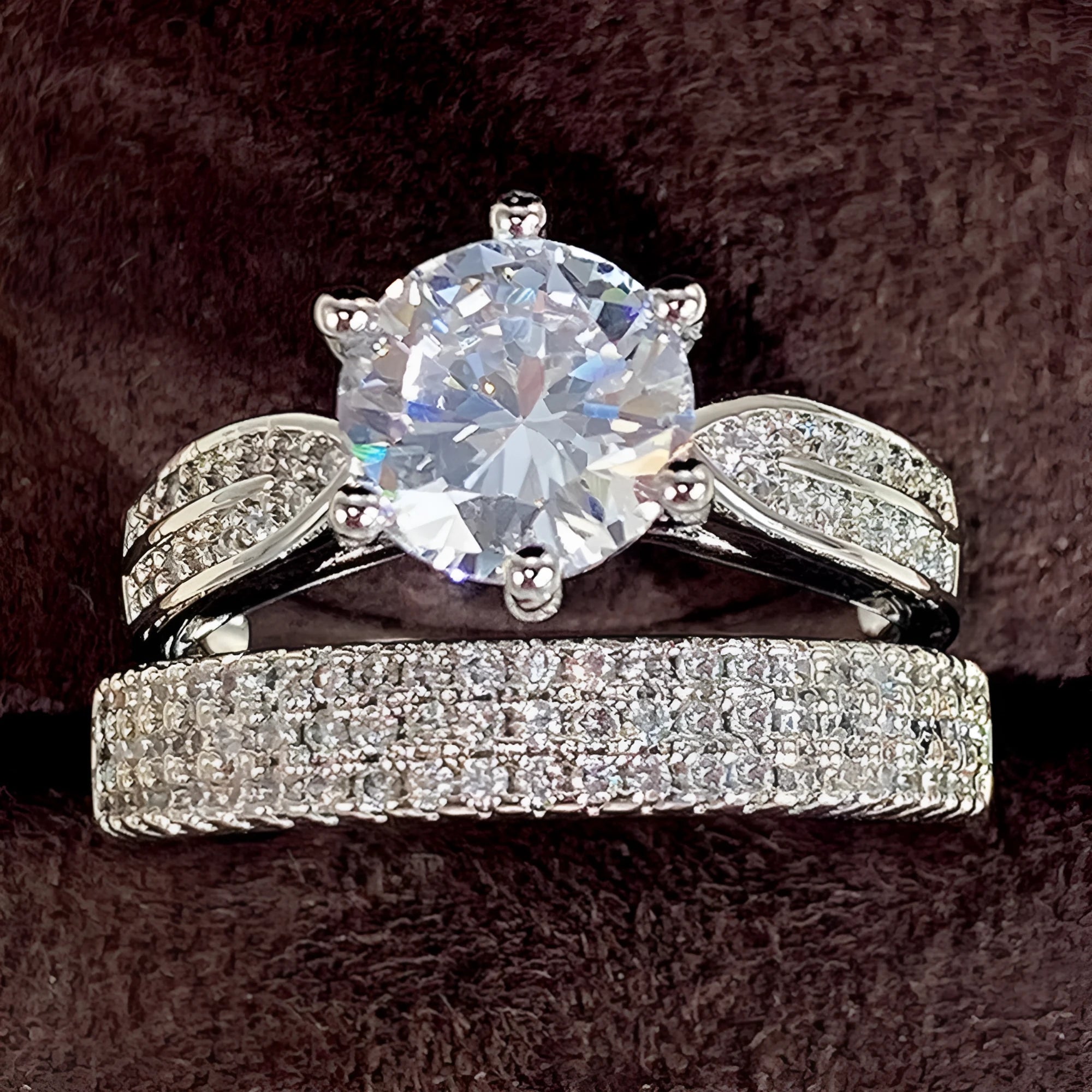 Geometric white gold colour alloy wedding ring on a finger, showing its round design.